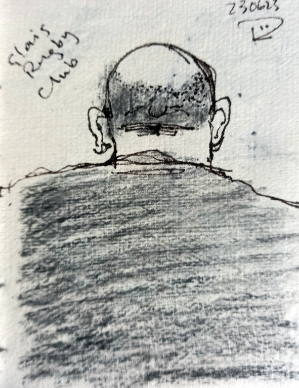 A drawing in pen and charcoal of the back of a stocky man, possibly a rugby player. He is bald on top with still some hair around the sides and back He has large ears that stick out. He's wearing a dark rugby shirt and his back and shoulders dominate the drawing.
