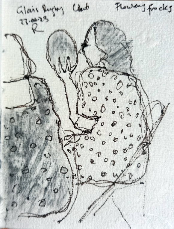 A drawing in pen and charcoal of two women in flowery frocks. One is drawn in profile, she has long dark hair and she is looking to the left and holding a balloon aloft in her left hand. The other is a half figure, up to the edge of the page, shown from behind. She has shoulder-length blonde hair.